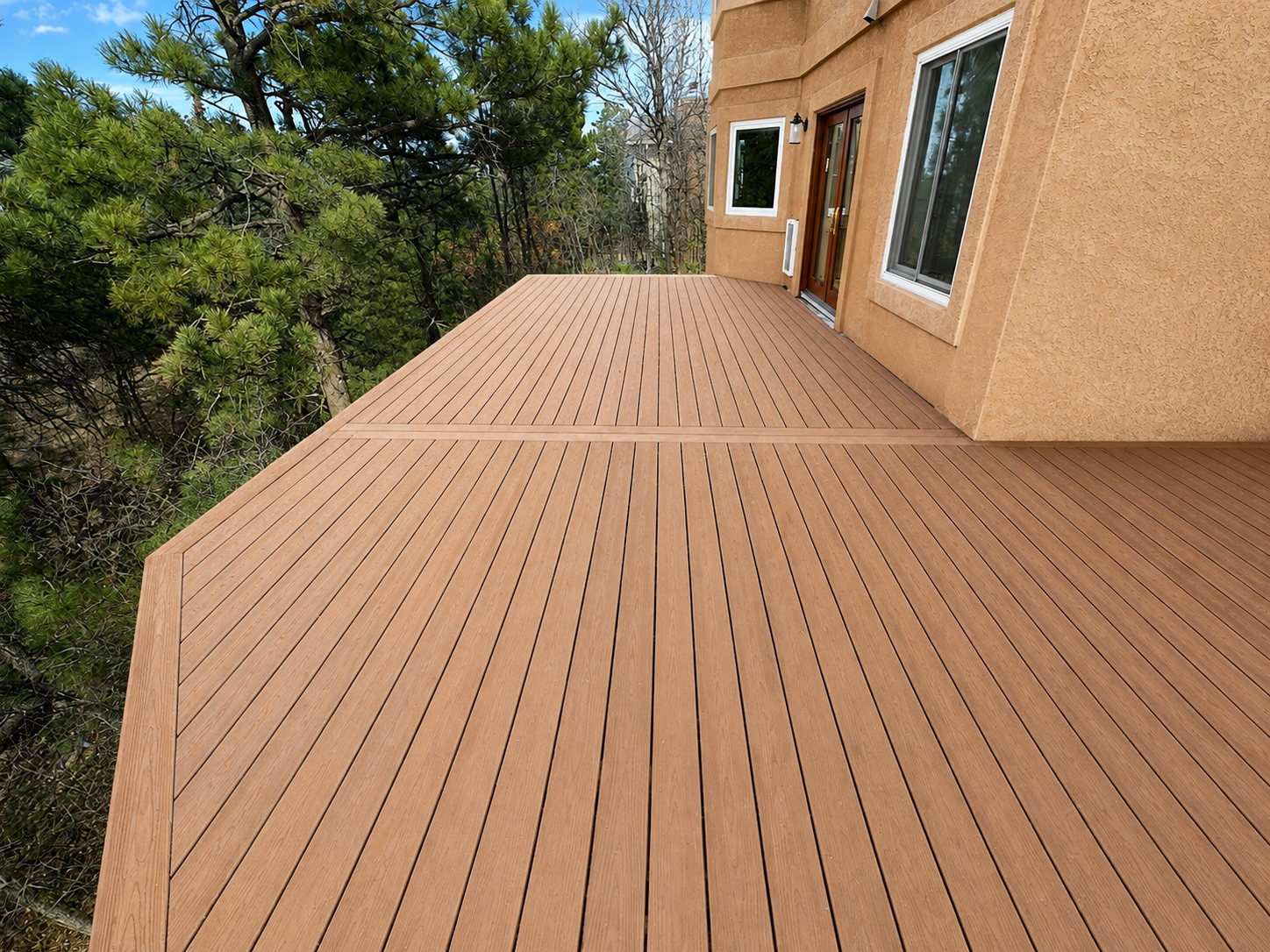 Custom composite deck with a picture-frame border built by Austin Texas Decks